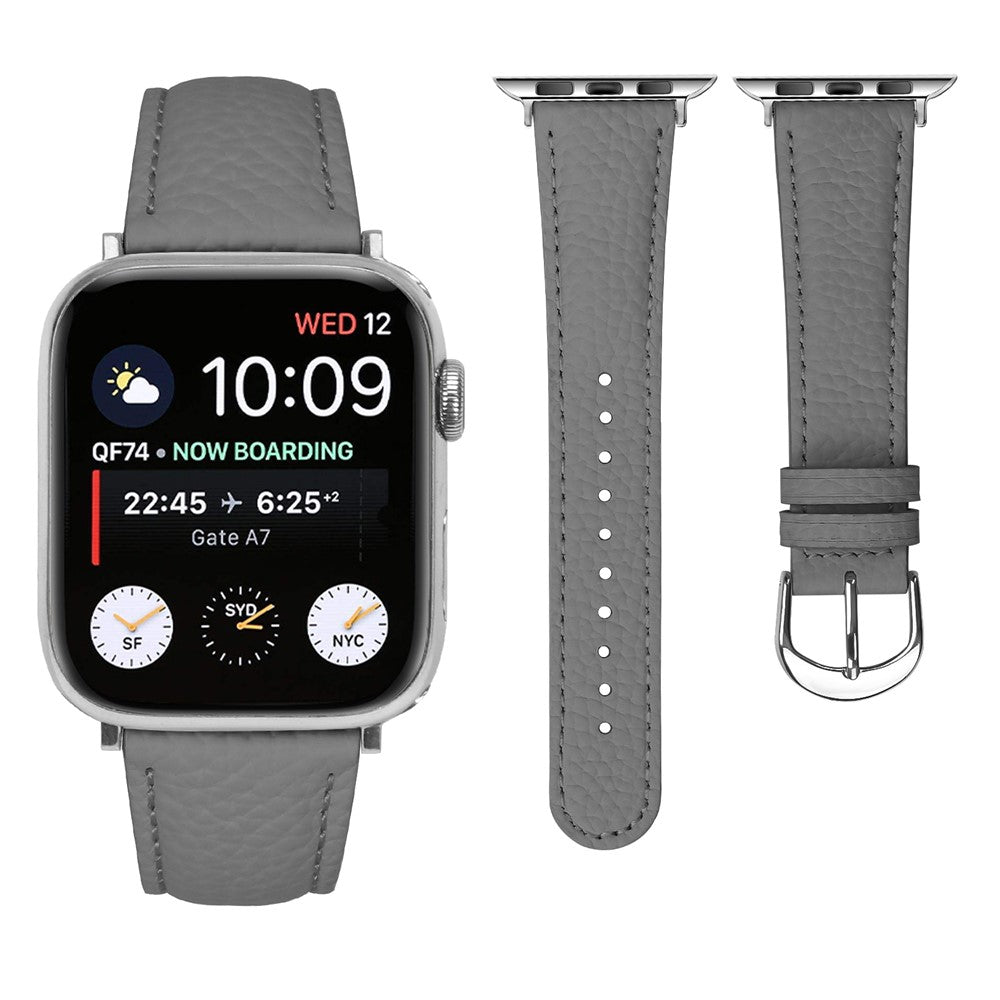 PU-läderarmband med litchimönster Apple Watch SE 44 mm, Apple Watch Series 1 42 mm, Apple Watch Series 10 46 mm, Apple Watch Series 11 46 mm, Apple Watch Series 2 42 mm, Apple Watch Series 3 42 mm, Apple Watch Series 4 44 mm, Apple Watch Series 5 44 mm, Apple Watch Series 6 44 mm, Apple Watch Series 7 45 mm, Apple Watch Series 8 45 mm, Apple Watch Series 9 45 mm, Apple Watch Ultra 2 49 mm, Apple Watch Ultra 3 49 mm Ljusrosa