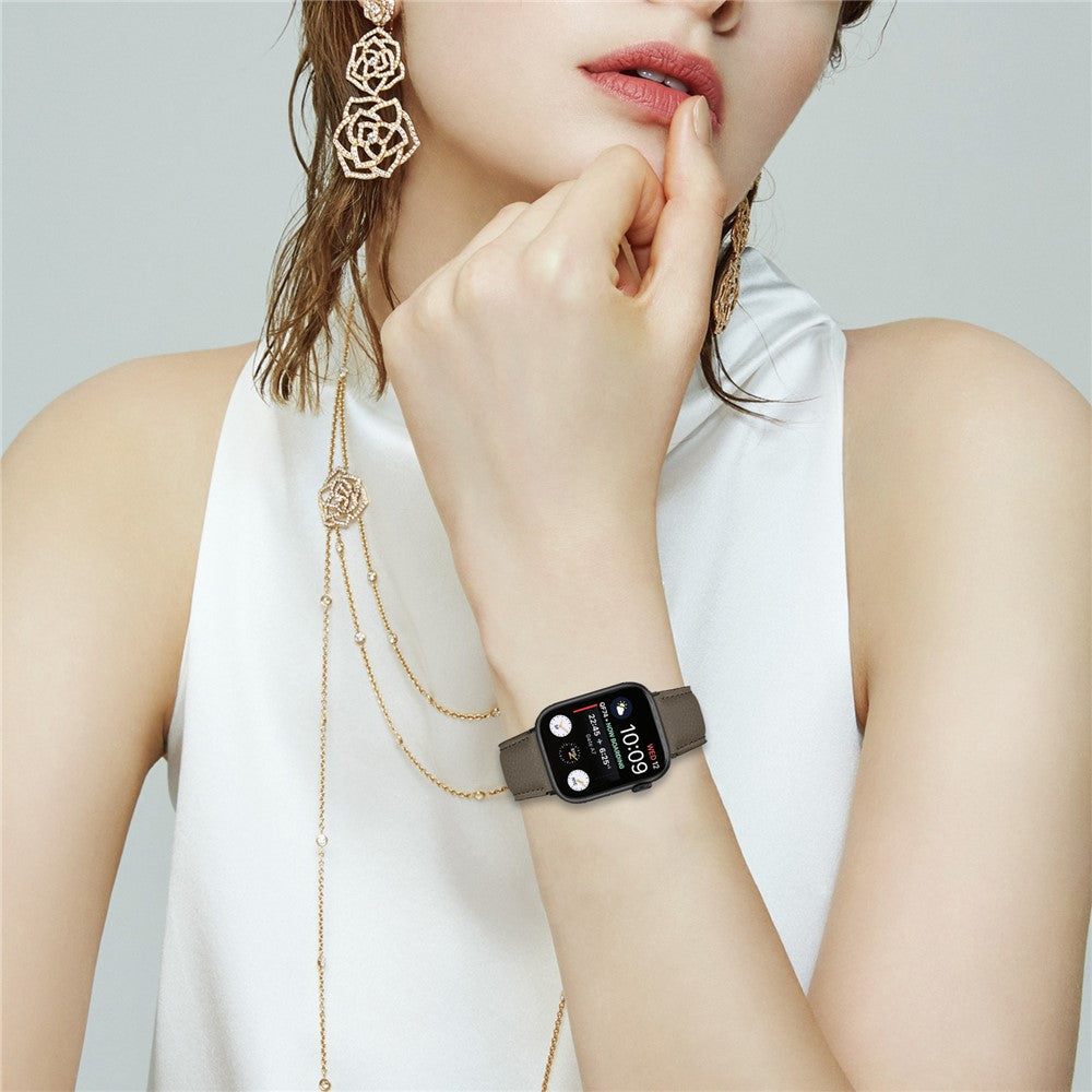 Läderarmband med svart fäste och klassisk spänne Apple Watch SE 40 mm, Apple Watch Series 1 38 mm, Apple Watch Series 10 42 mm, Apple Watch Series 11 42 mm, Apple Watch Series 2 38 mm, Apple Watch Series 3 38 mm, Apple Watch Series 4 40 mm, Apple Watch Series 5 40 mm, Apple Watch Series 6 40 mm, Apple Watch Series 7 41 mm, Apple Watch Series 8 41 mm, Apple Watch Series 9 41 mm Sandbrun